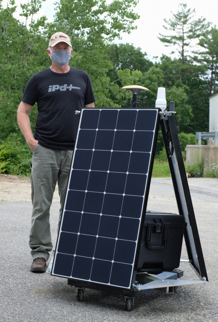 Haystack technician Ken Wilson with a SIDEx buoy prototype