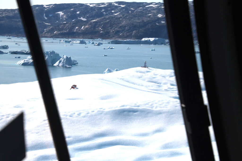 GPS receiver deployment on an iceberg in Sermilik Fjord, Greenland